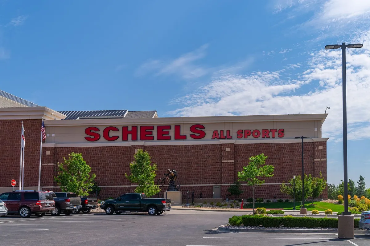 The brick Scheels All Sports store at Johnstown Plaza on a summer day