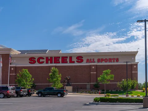 The brick Scheels All Sports store at Johnstown Plaza on a summer day